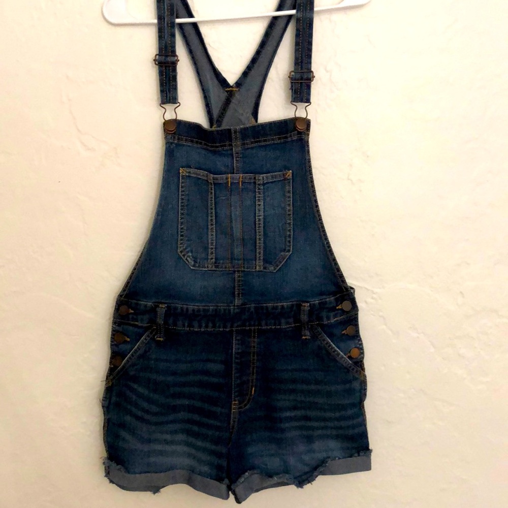 Jean short overalls. Very cute front pocket.
